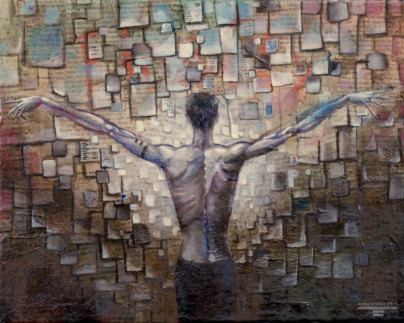 A thin man standing in front of a wall covered in pages of paper in all sizes. His arms are outstretched on either side like wings.